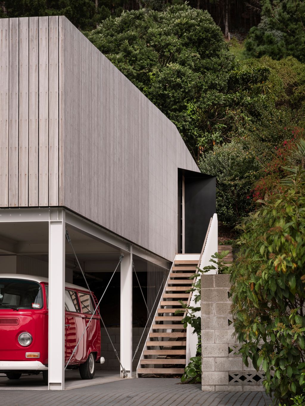 Front view of the home with the architectural features including the steel portal frames.