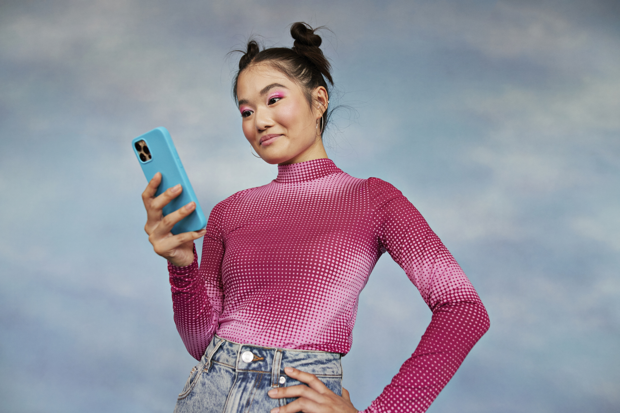 Women standing up looking down at her phone