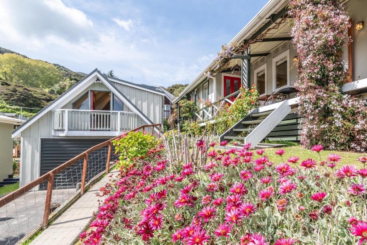 The cottage has a plentiful garden and good outdoor living spaces.