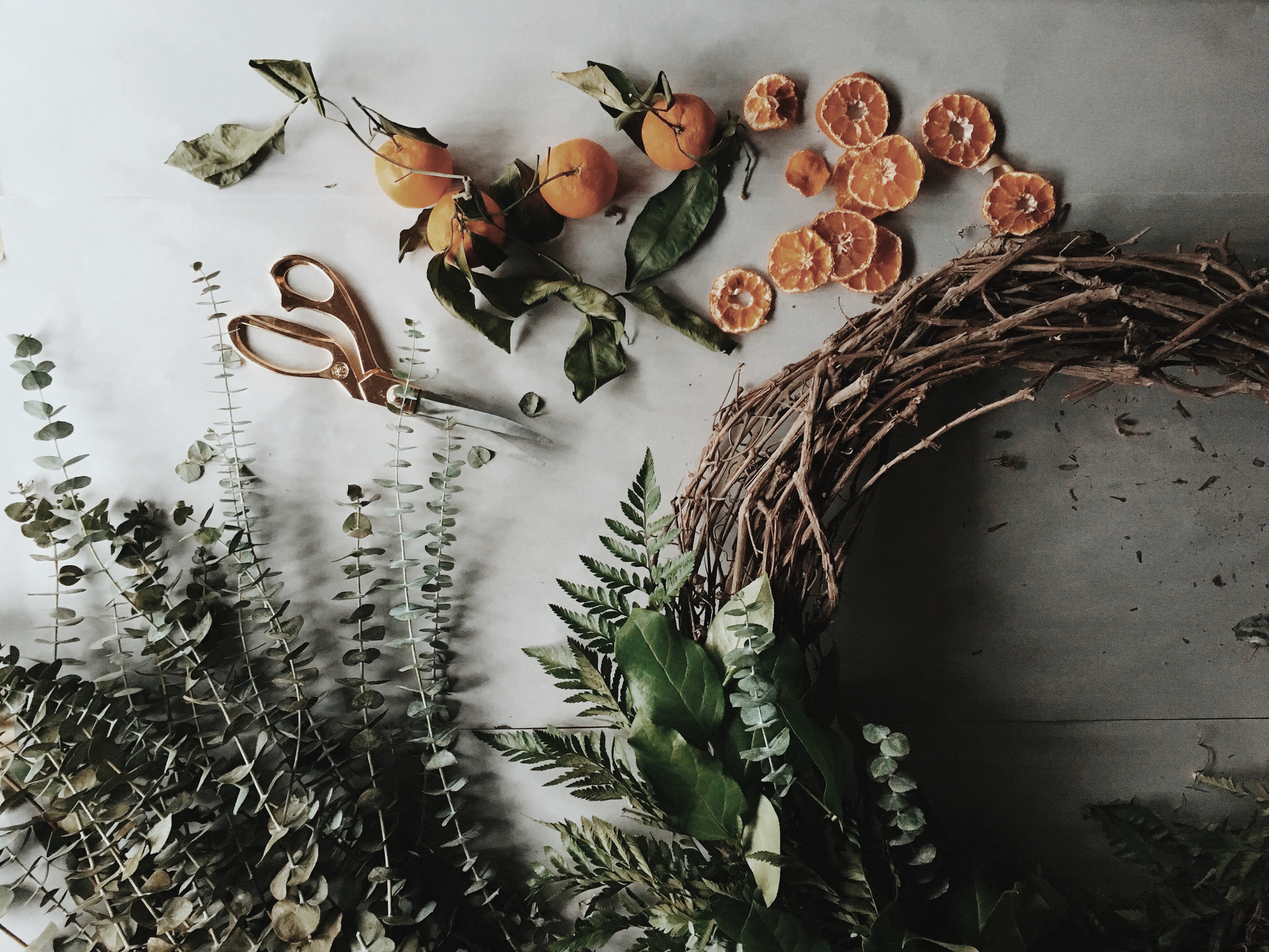 Christmas wreath made from woven sticks and garden flora