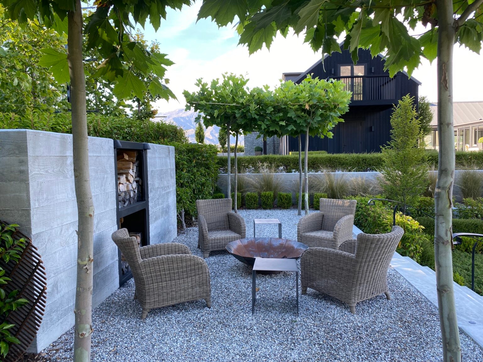 Layered landscaping, such as in this award-winning landscape by Baxter Design Group, that features areas of interest and places to relax will ensure visitors to your garden enjoy a resort-style atmosphere.