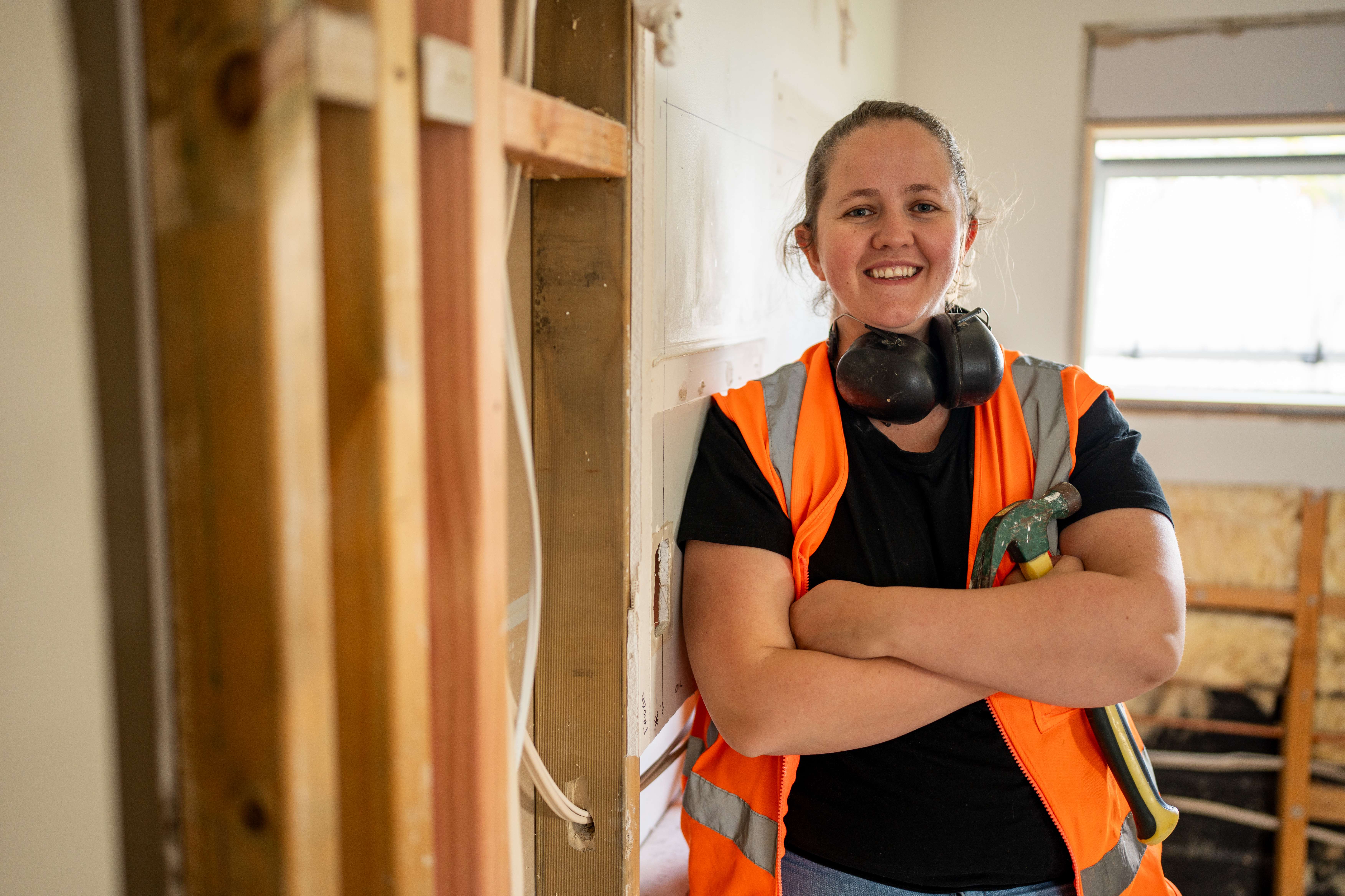 Female tradie on-site in New Zealand.