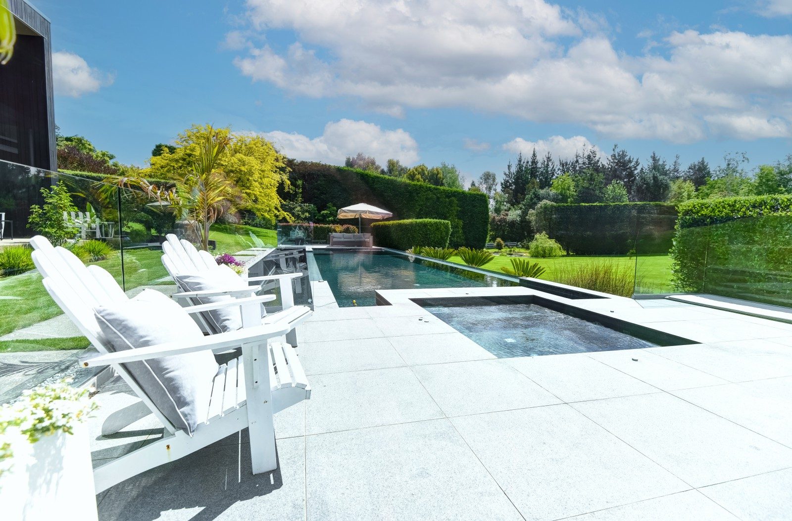 A solar-heated swimming pool and built-in spa