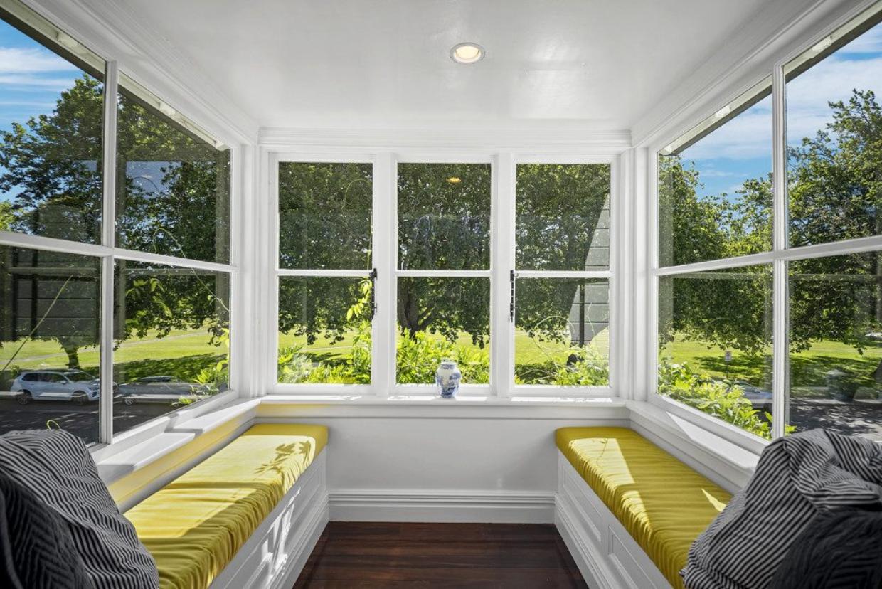 Sun streams into the north-facing sunroom, which maximises the leafy outlook.