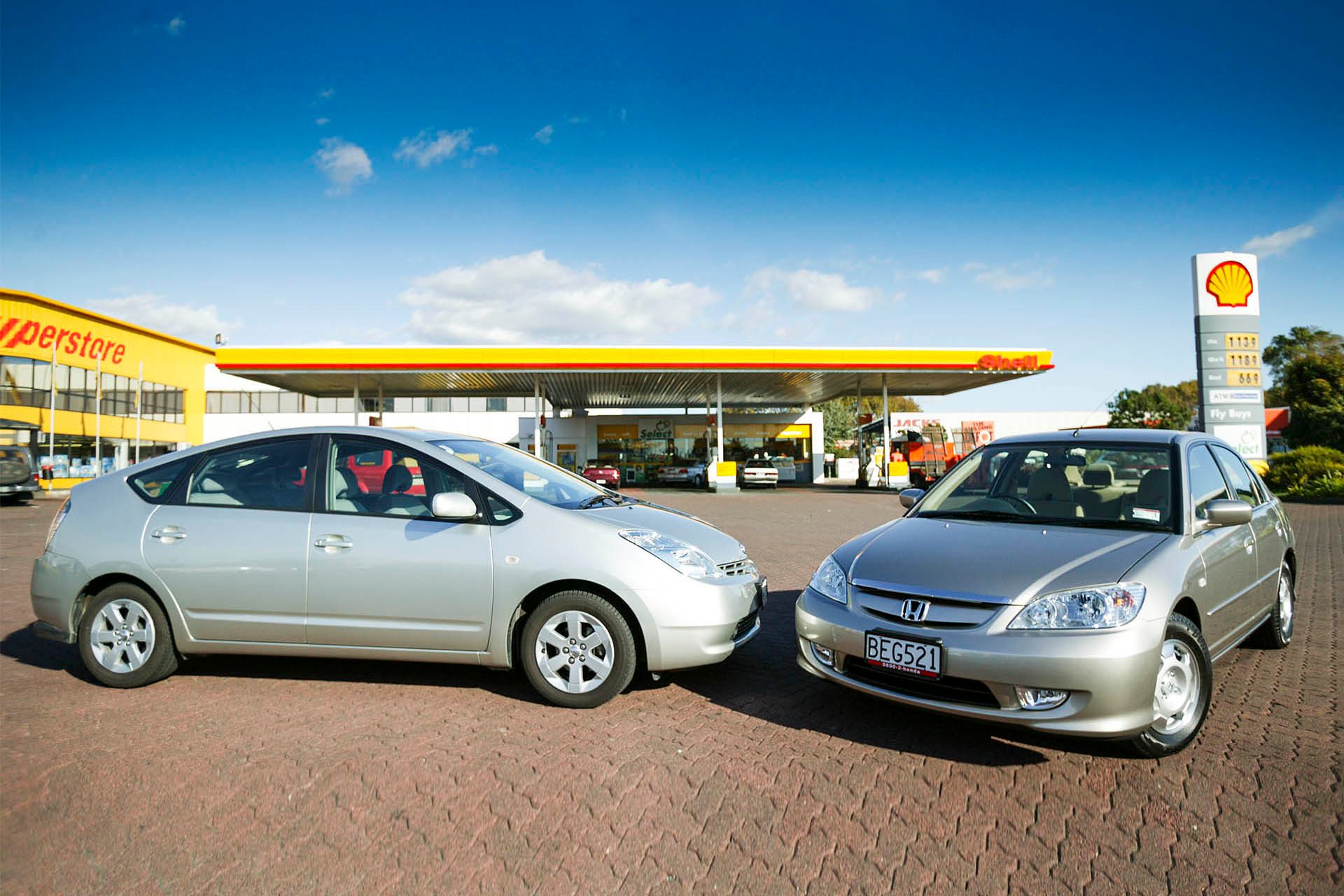 hybrid cars at petrol station