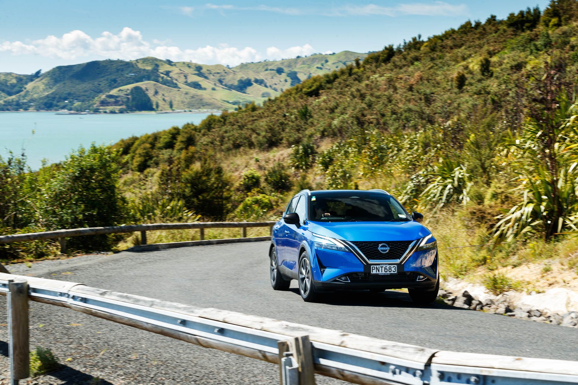 Blue Nissan Qashqai Ti action shot from front view