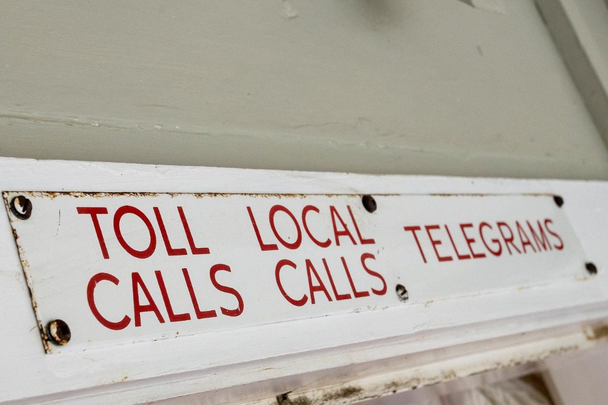 The cottage still retains a old sign from its days as the local telephone exchange