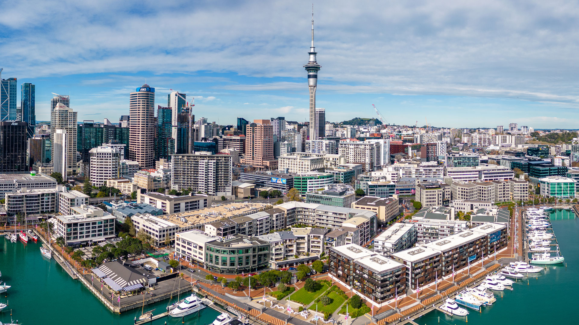 An image of the Auckland city waterfront with the Sky Tower in the background.