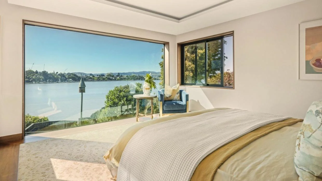 The master bedroom has a monumental bedroom window.