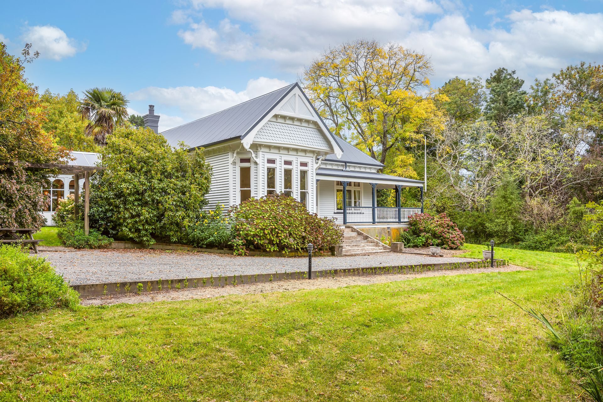 Built in 1910, this Waimakariri, Canterbury home has the classic roofline and verandas typical of the era.