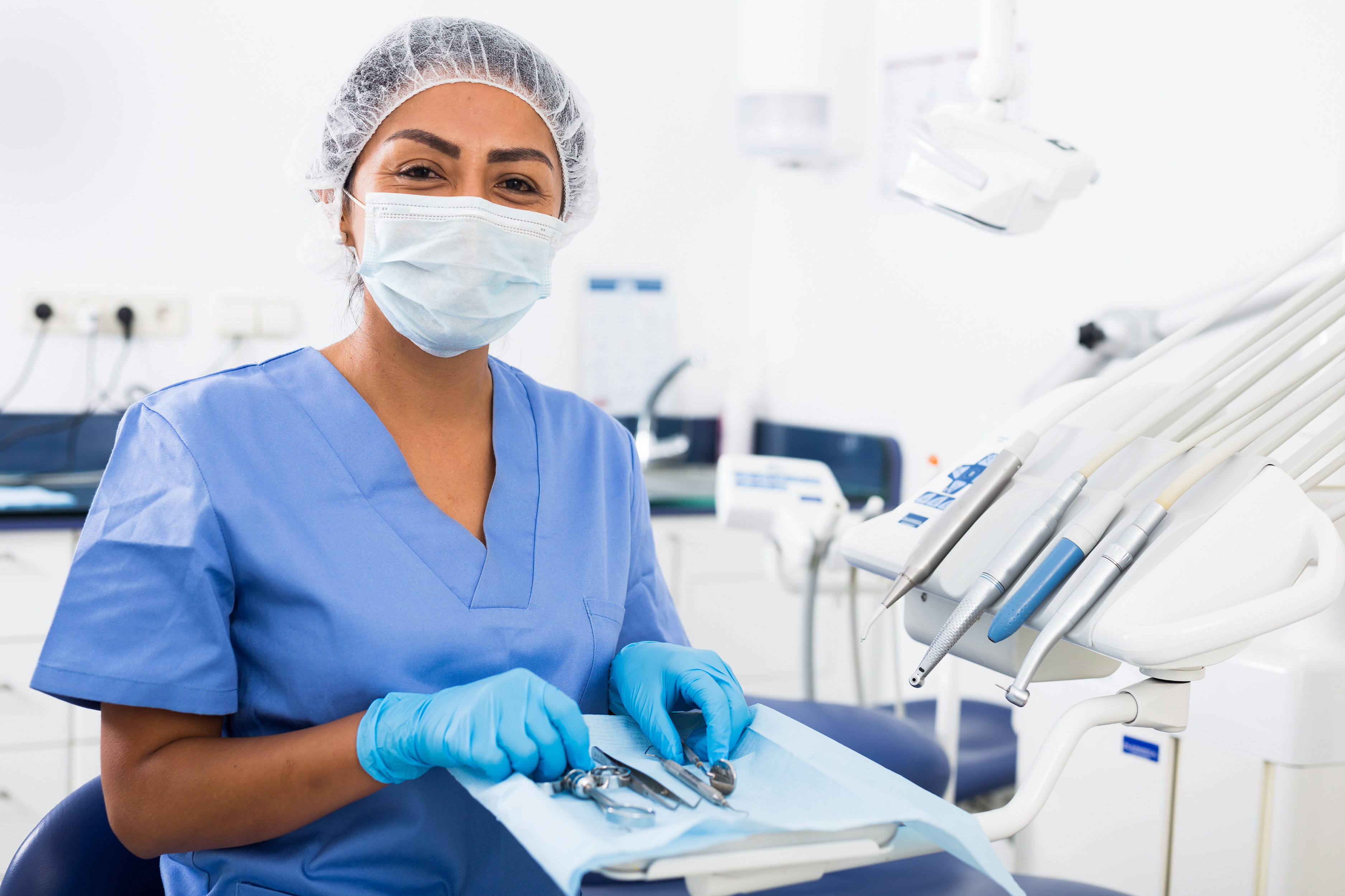 Female dental assistant in gear