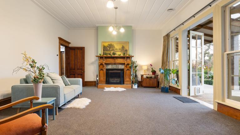 The large fireplace in the living room is a favourite of Vanessa’s. Photo: HARCOURTS/TRADE ME