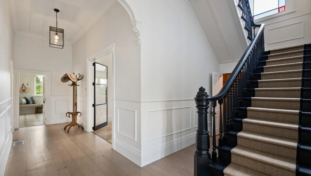 The staircase was the only feature from the previous house to survive. 