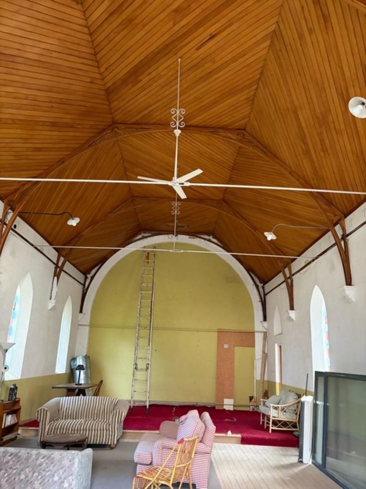 The 100-square-metre church features a spacious main room and timber ceiling, but has no separate bedroom or bathroom. Photo: Supplied