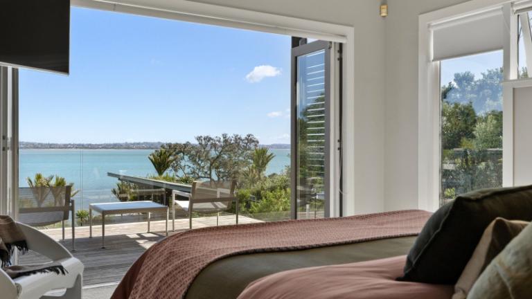 The owners say their bedroom, with its own deck, is their favourite place to relax. Several times a year they see orca and dolphins. Photo: NZ Sotheby's