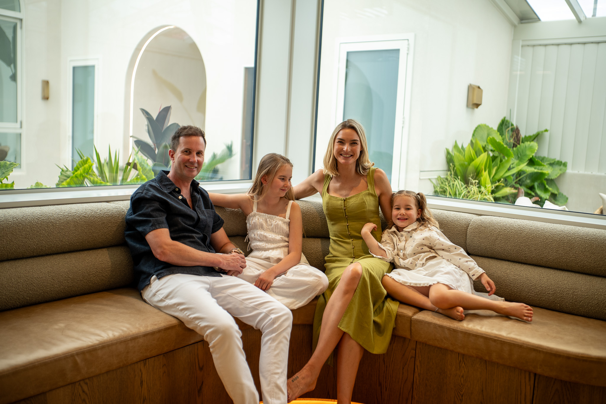 family on couch laughing