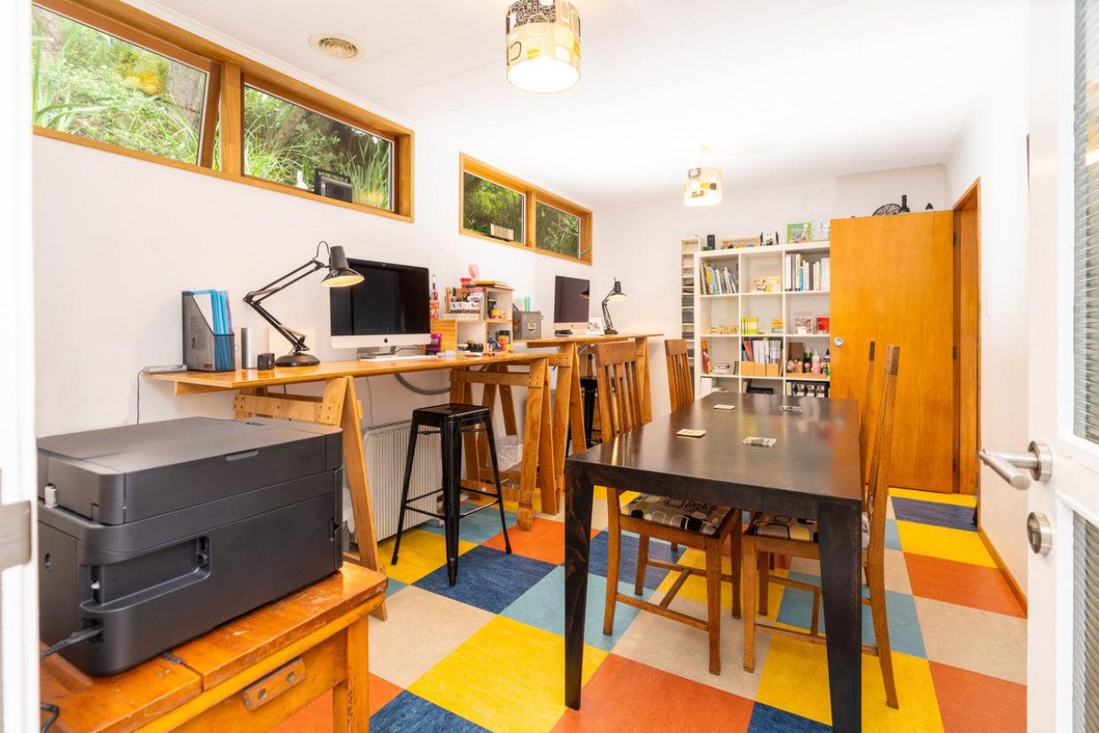 The couple joined two small bedrooms to make one large room, which they use as their office. Photo: Lowe & Co