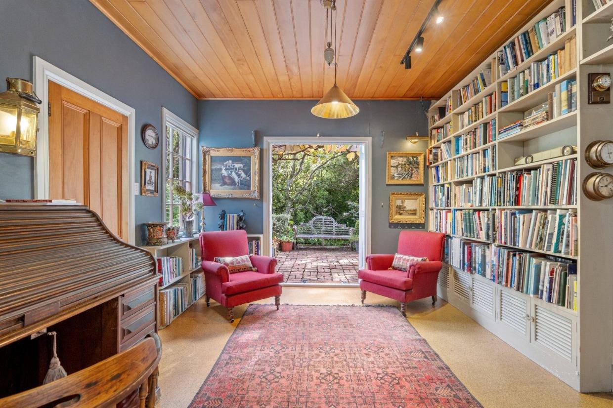 Calming room offering availability for seating and a bookshelf. 