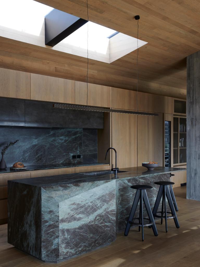 With its faceted stone front, the island reflects the changing light throughout the day. Photo: Jackie Meiring