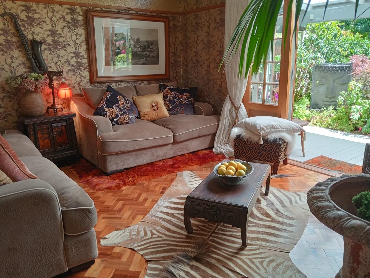 The living room has a beautiful parquet floor. 