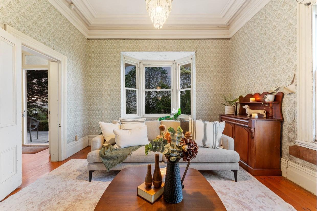 The soaring ceilings are a plus. But in places the wallpaper is peeling.