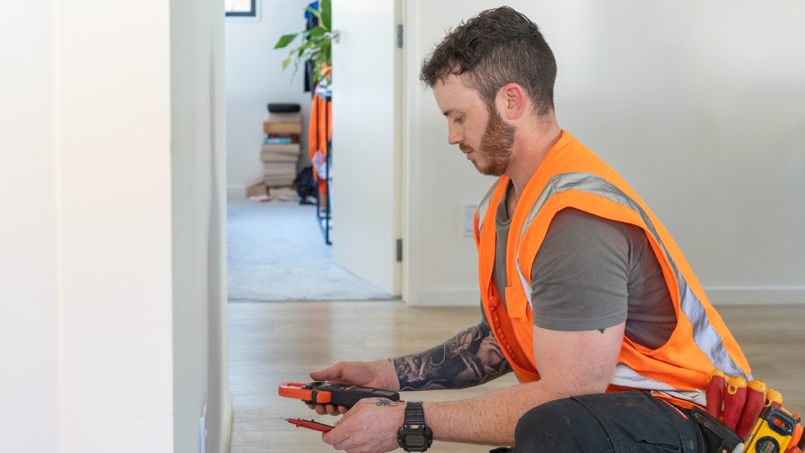 Electrician working on house