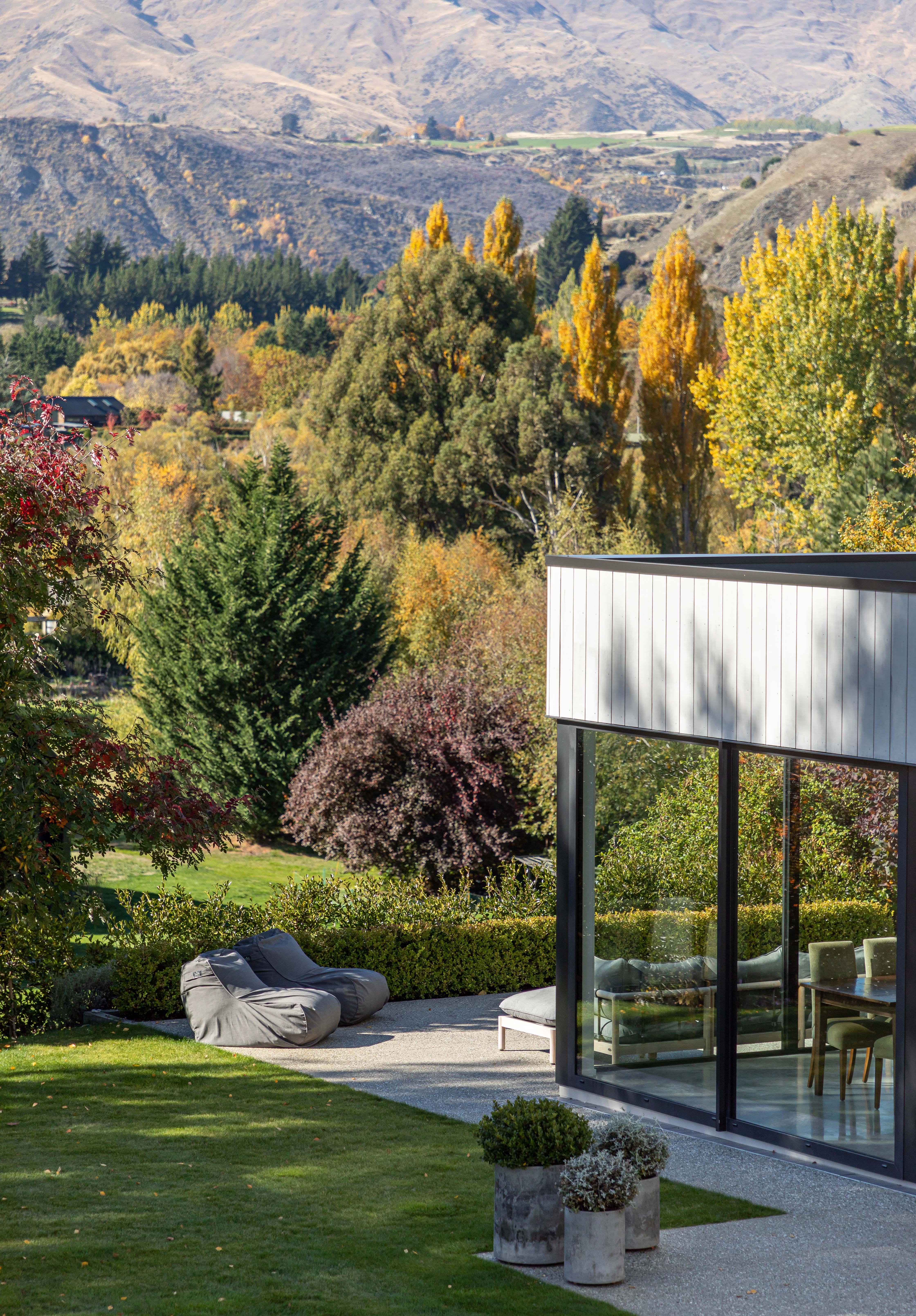 This simple landscaping plan at a Queenstown home designed by KOIA Architects utilises borrowed views of the dramatic surrounding alpine environment to enhance the private garden experience. Image: John Williams.