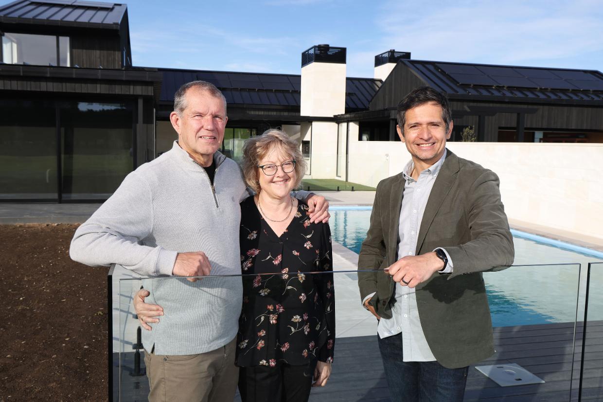 Owners pictured with presenter after achieving their dream house.