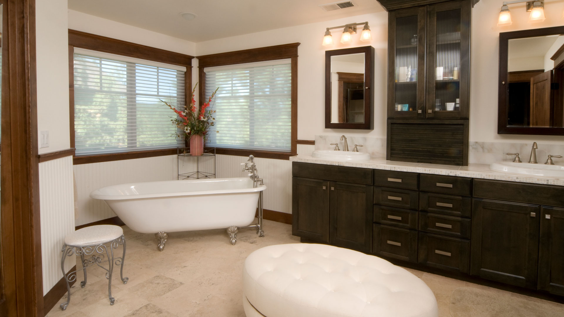 A smart modern bathroom in NZ with a claw-foot bathroom in the corner of the room.