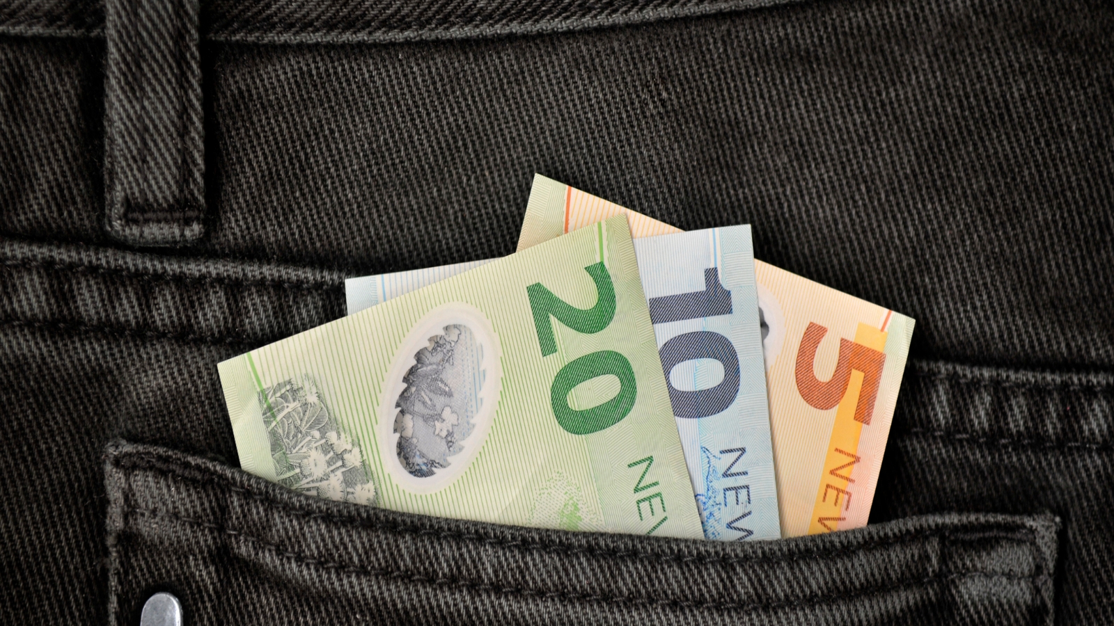 Image of NZD in backpocket of jeans. 