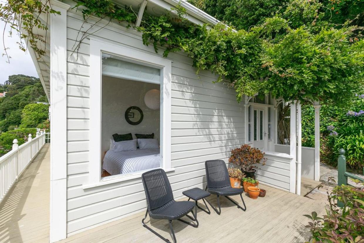 Bedroom is accessible to the deck on the property. 
