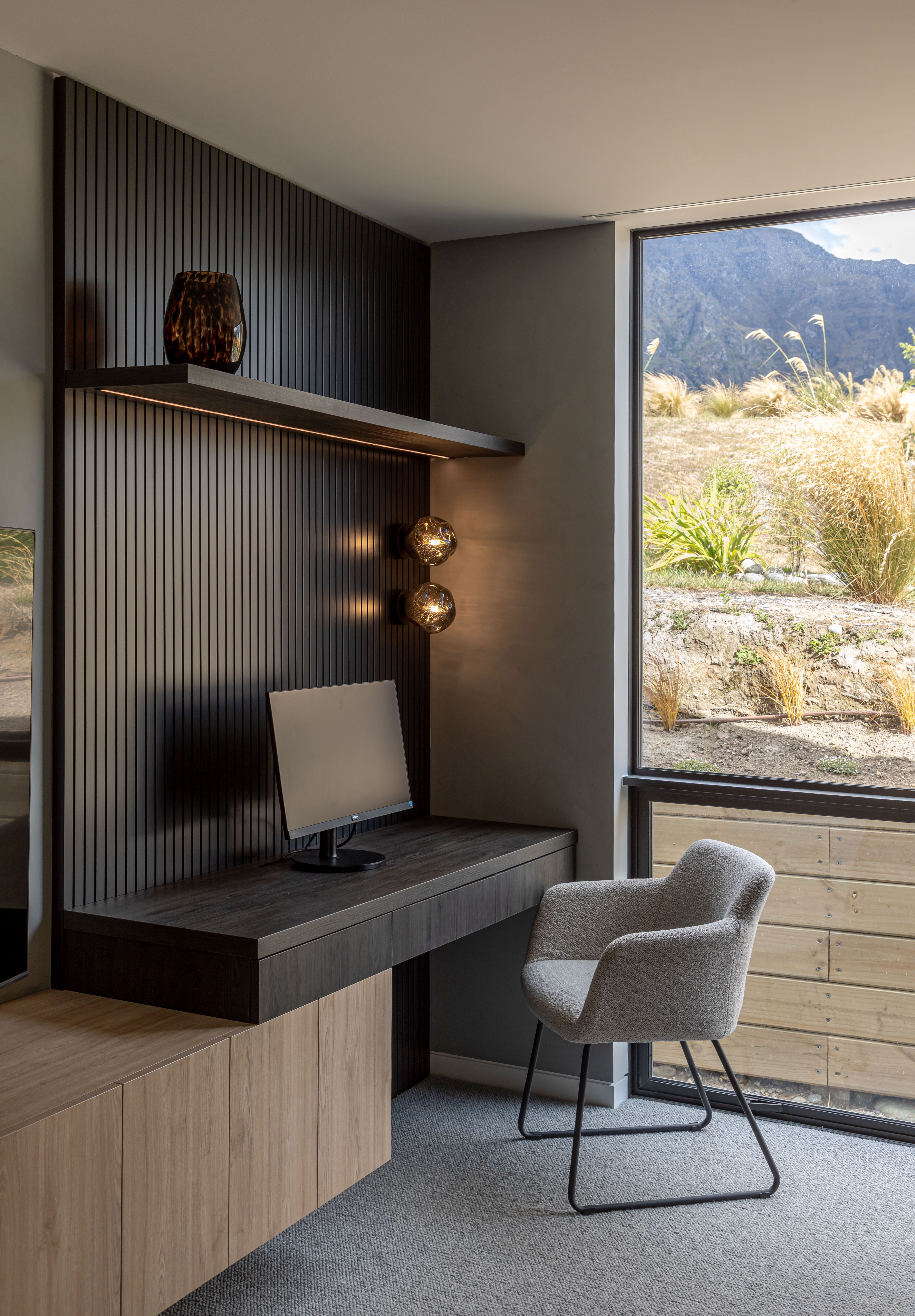 In this home by Ben Hudson Architects, wood panelling is used to create a focal point for an office nook. Image: John Williams