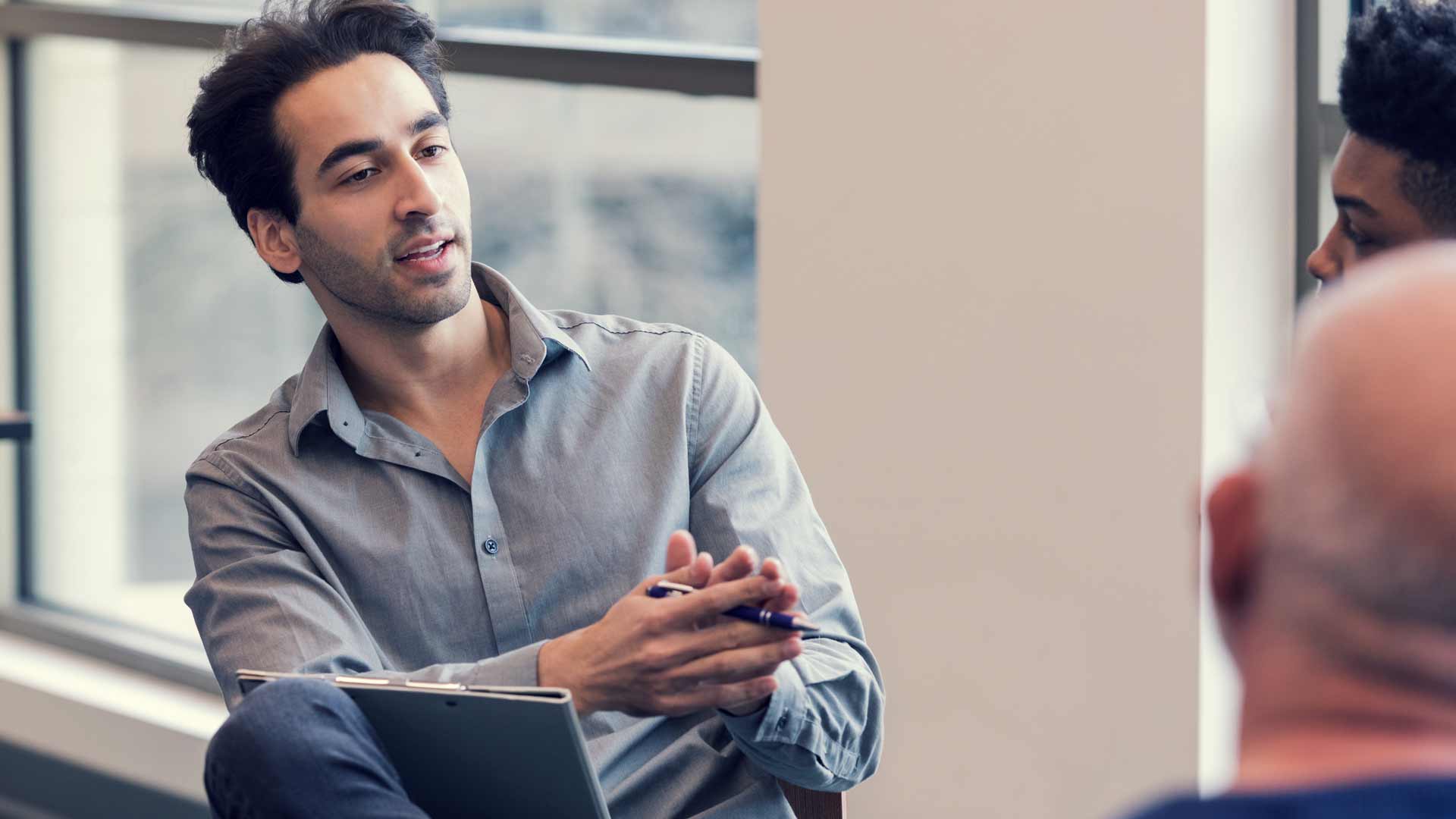Counsellor offering advice to patients in a group session.
