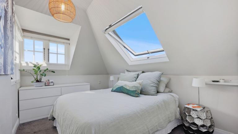 All three bedrooms have vaulted ceilings that follow the rooflines. Photo: Ray White