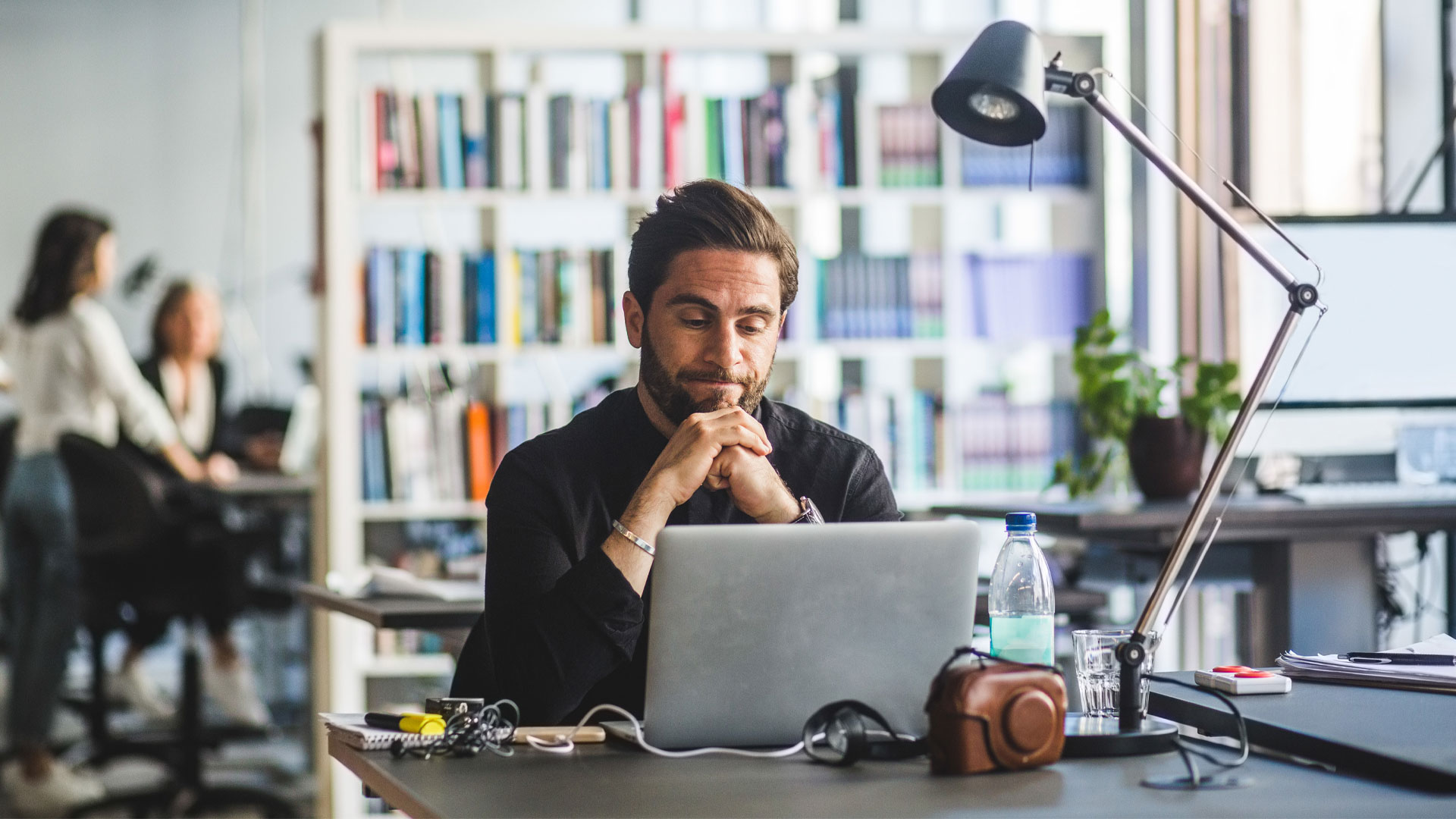 Man researching salaries at work.