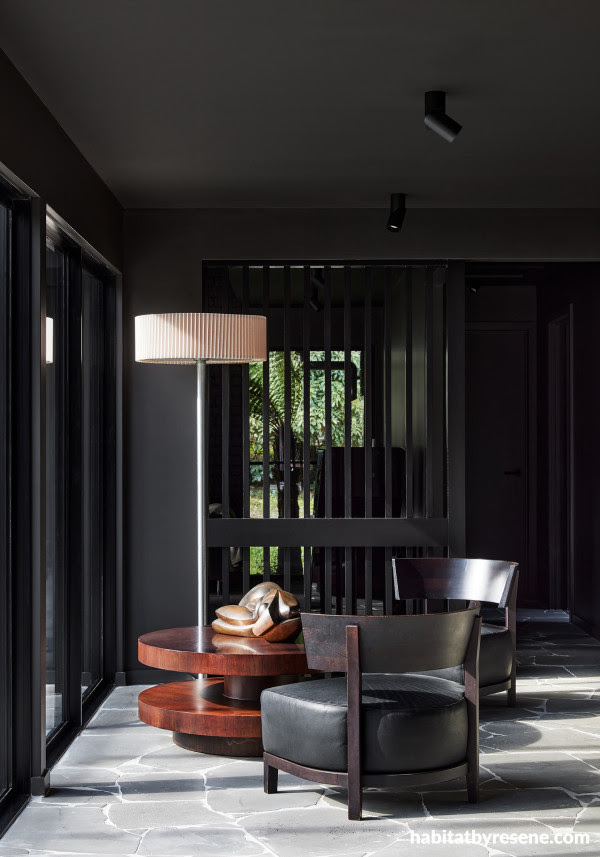 An interior space painted in a dark iron shade