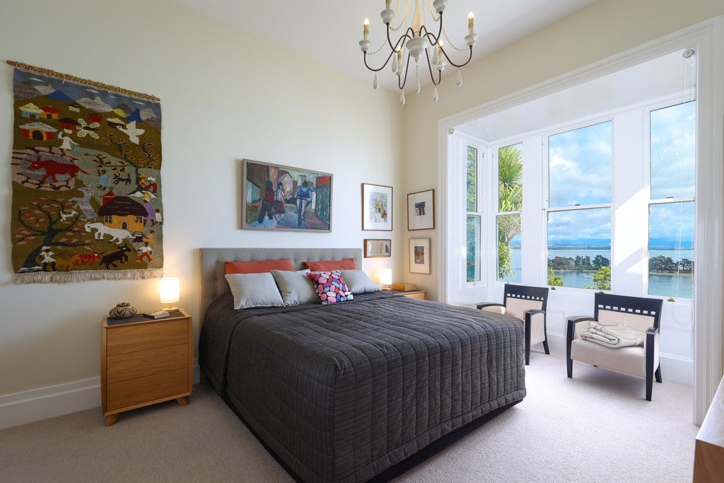 Main bedroom with mesmerising views captured from the bay window. 
