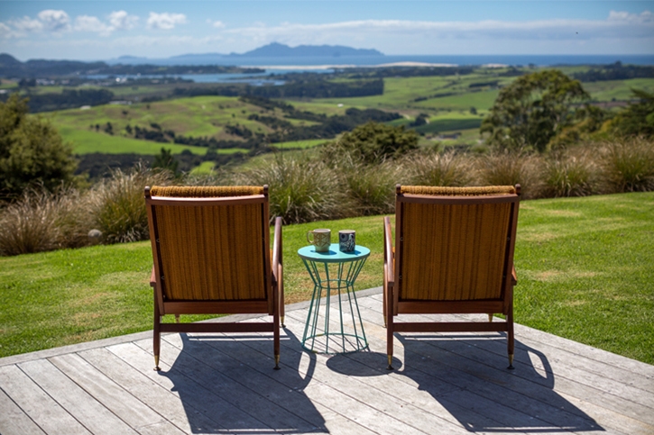 Preloved outdoor furniture from Trade Me set up on a deck facing the landscape
