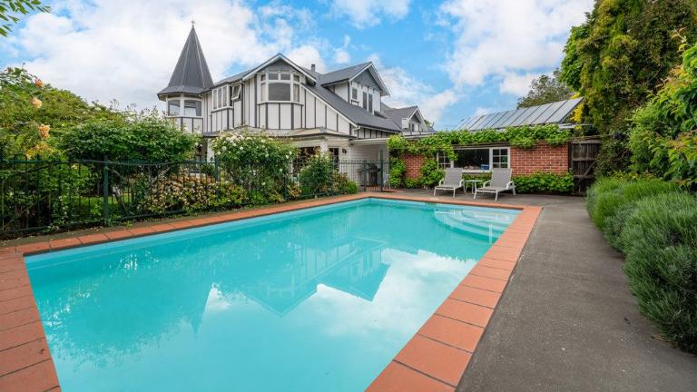 The property has a large swimming pool plus expansive lawns, gardens and mature trees. Photo: Harcourts