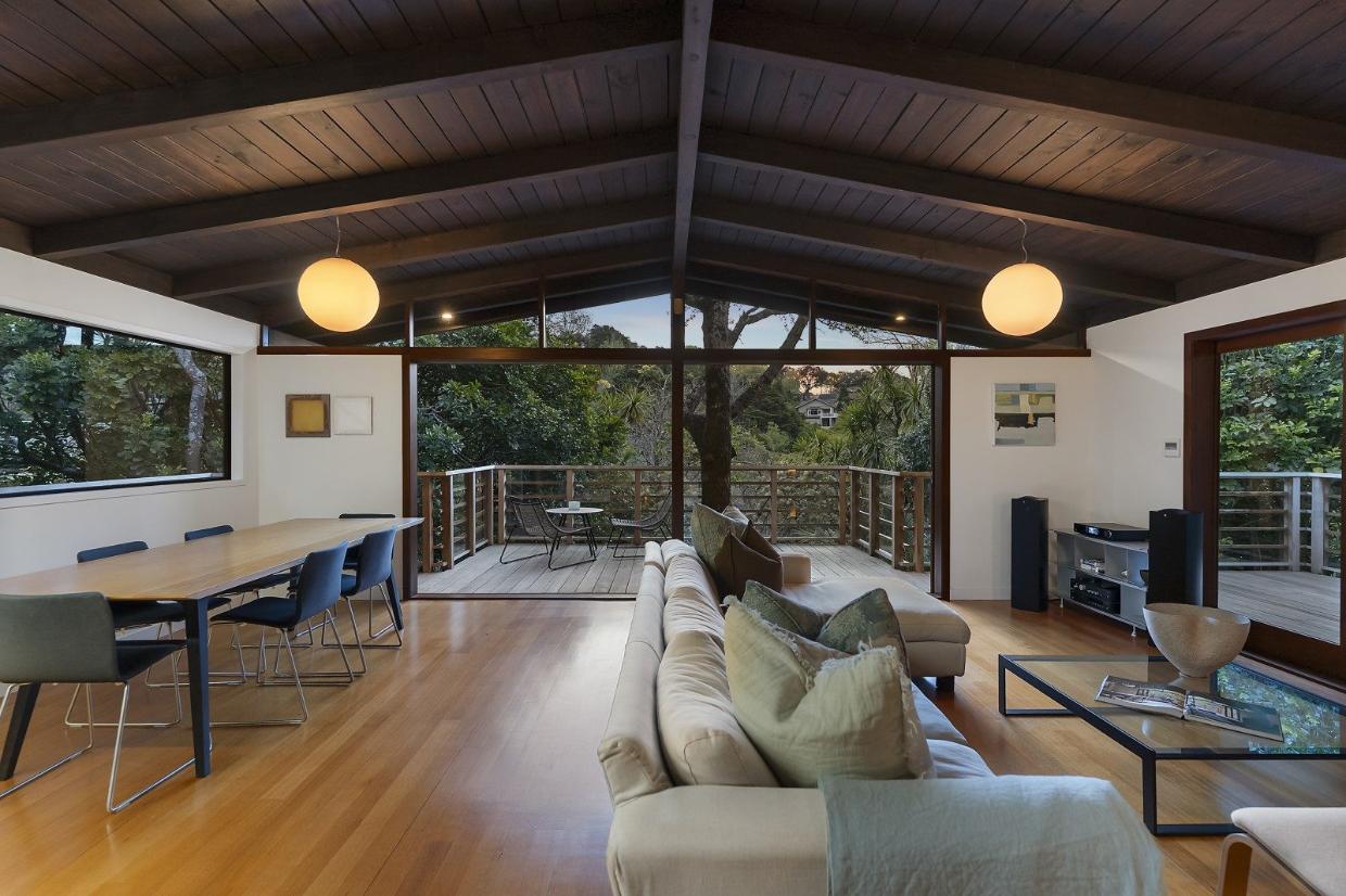 Large openings to the outdoors were also created. The dark-stained ceilings were a feature of the original house. Photo: NZ Sotheby's