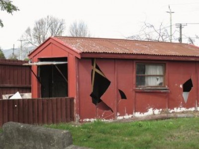 Small red shed with Asbestos cladding
