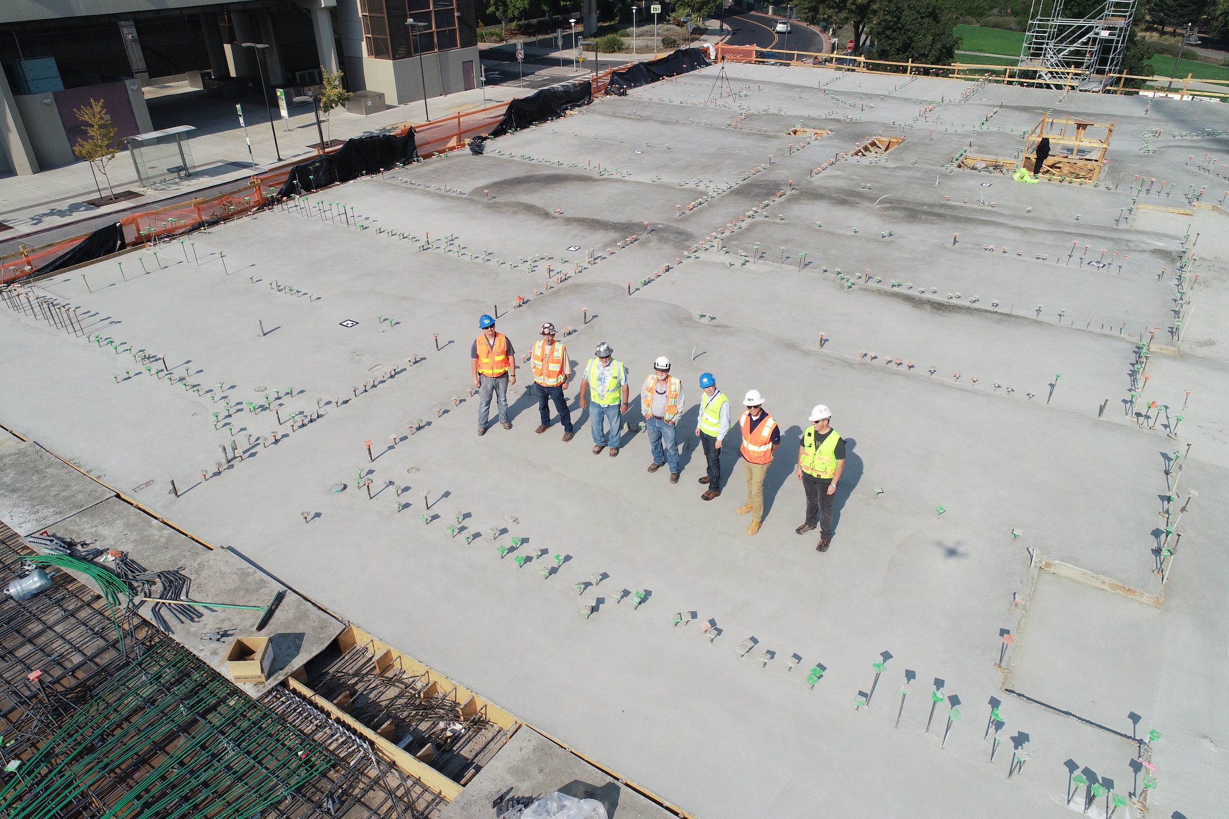 Group of engineers standing together on a building site