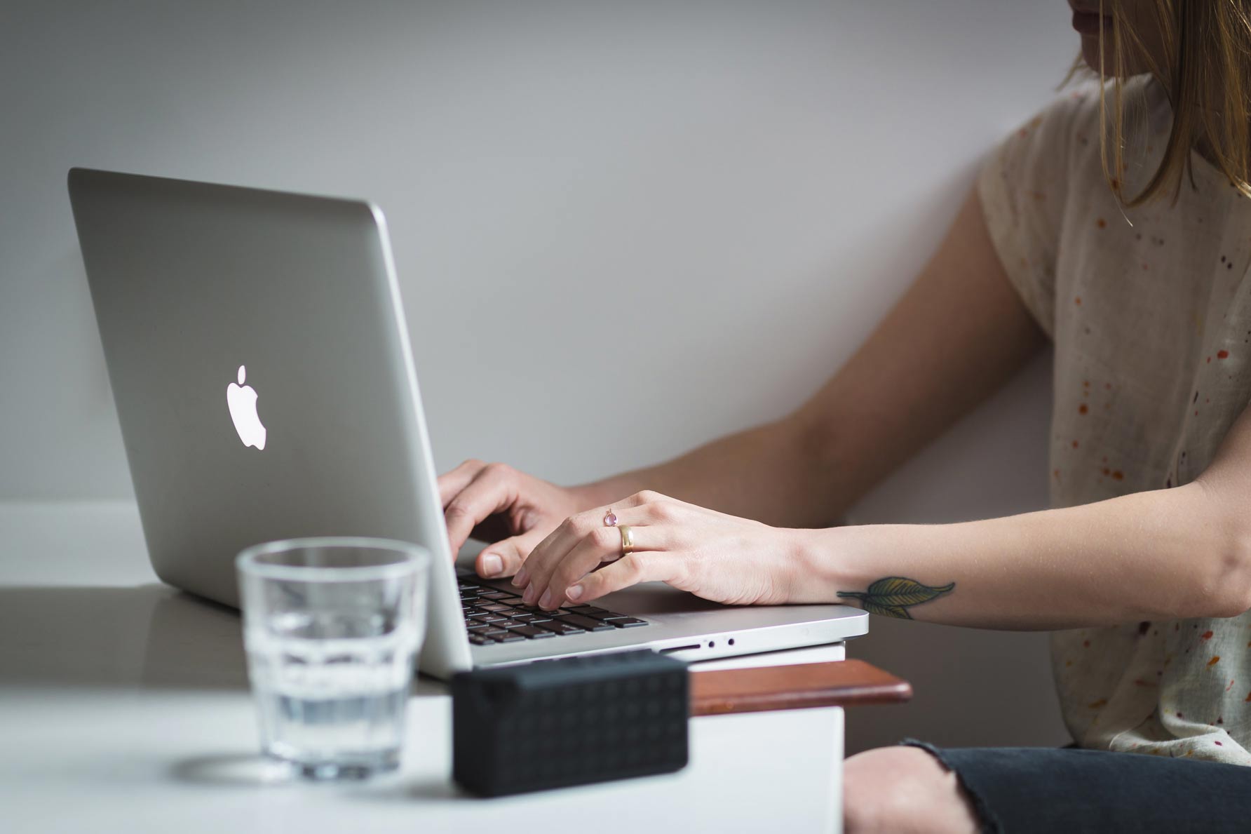 Woman searching on her Apple Macbook Pro