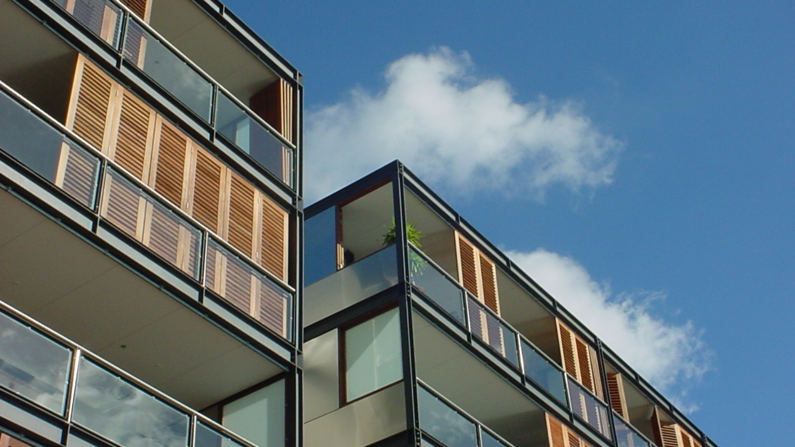 Image of modern apartments against sky. 