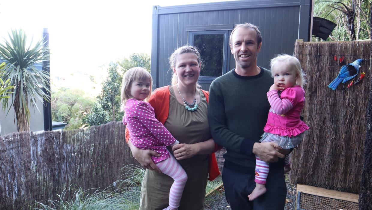 The Isherwoods stand in front of one of their pods in 2023. 