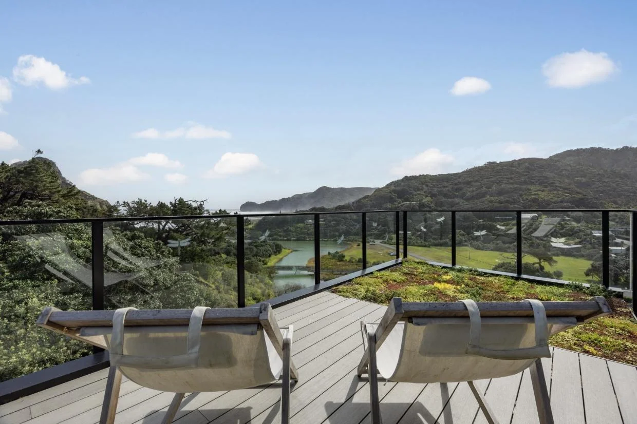 A roof deck with views over Piha