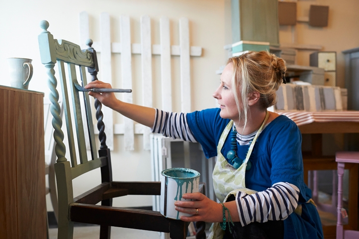 Woman upcycles old furniture by updating it with a lick of paint