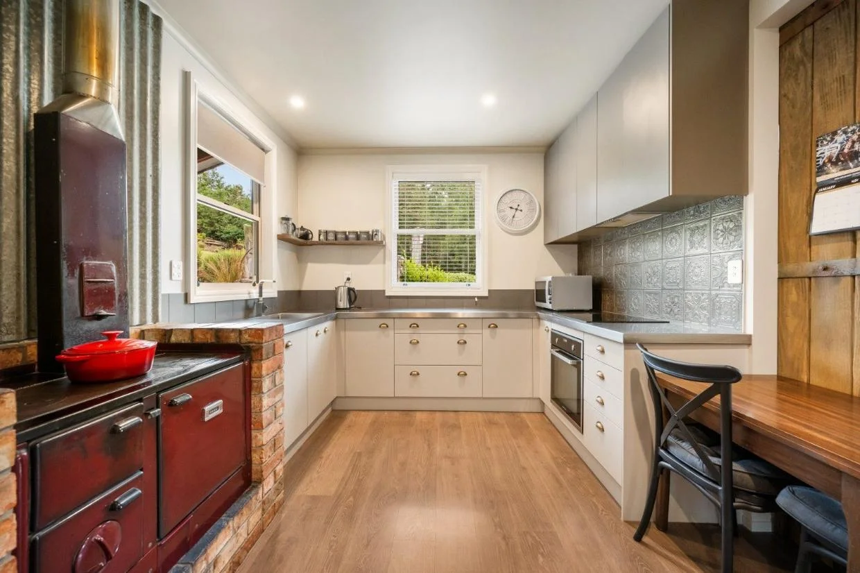 The kitchen has a coal range. 