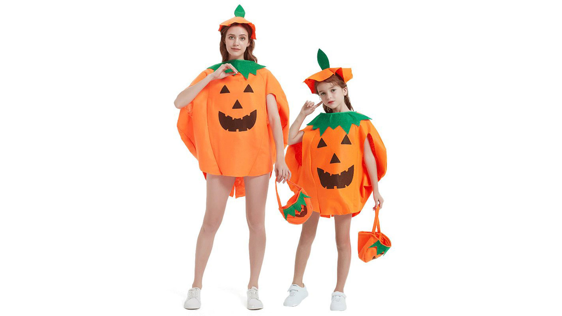 Mother and daughter dressed up in pumpkin costumes for Halloween.
