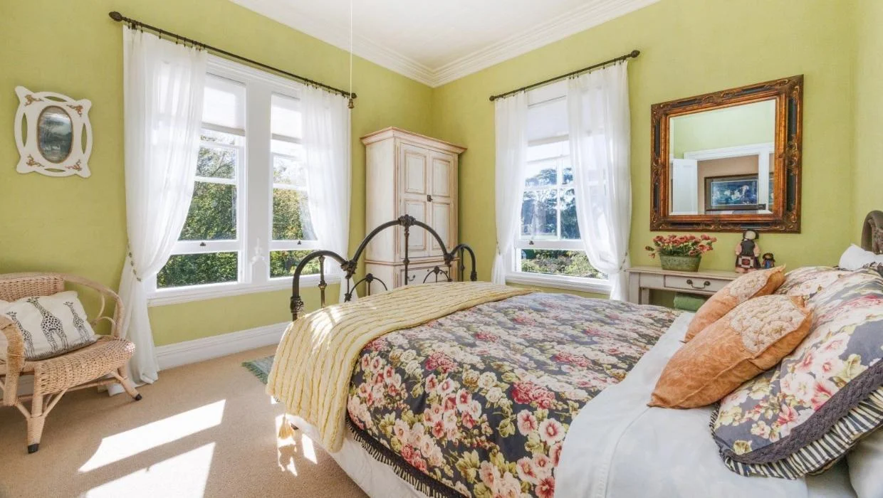 The home has four bedrooms. One of them is pictured here.